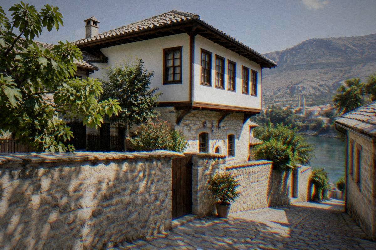 An Ottoman house of stone and white plaster with a timber upper floor and a walled courtyard area in Donja Mahala, Mostar, Kajtaz House