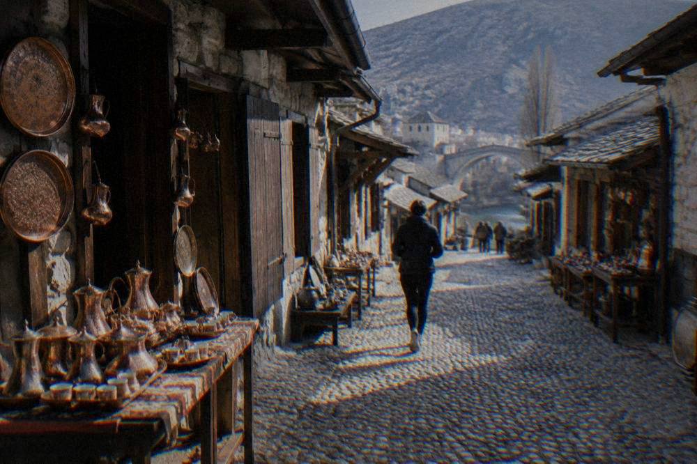 A stone alley in the Kujundžiluk bazaar in Mostar with copper shop fronts
