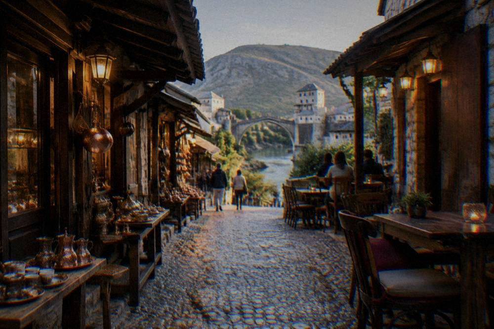 Cafe lights and stone buildings in the old bazaar street of Mostar in the evening