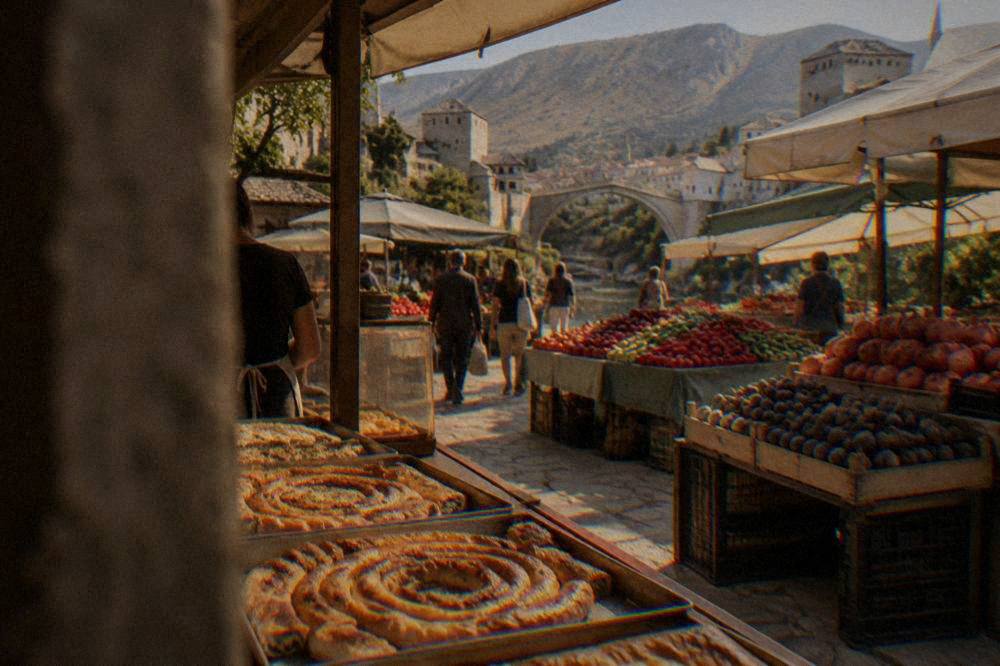 A bakery counter in Herzegovina with spirals of burek and other filled pies on metal trays