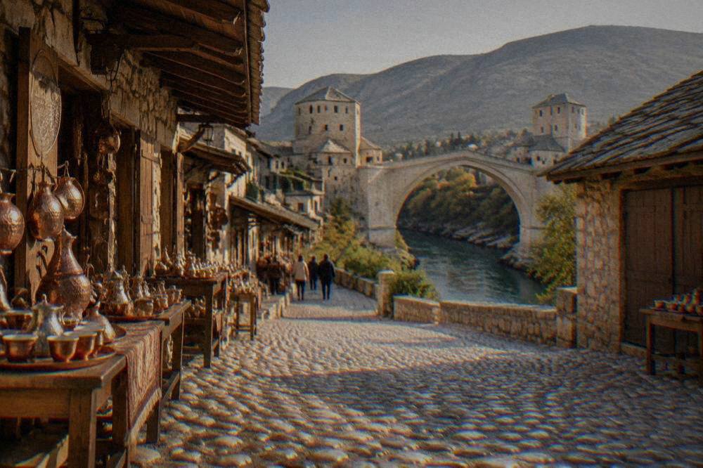 Cobblestone street and stone shops of the Kujundžiluk bazaar leading toward the Old Bridge in Mostar