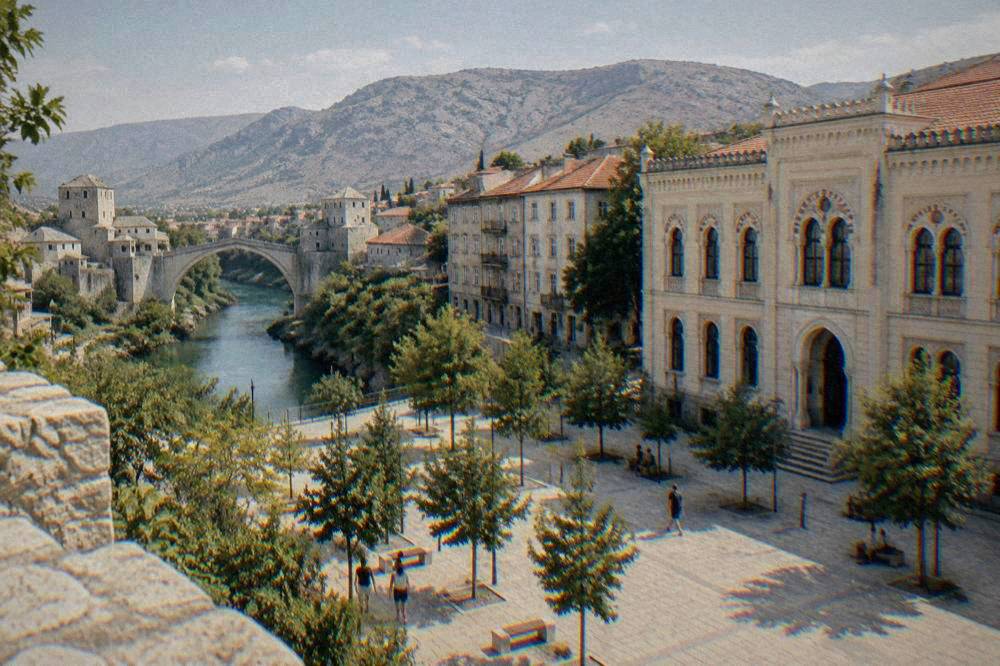 The Neretva river path on the western bank with the Old Bridge in the distance