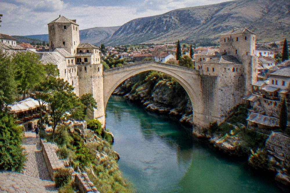 The Neretva river and the Old Bridge seen from the west bank in Mostar