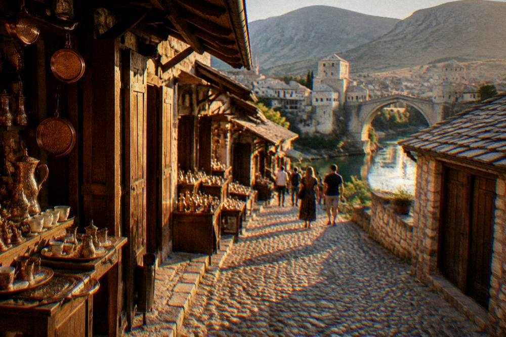 Warm evening light on a stone bridge and the facades of old houses in Mostar