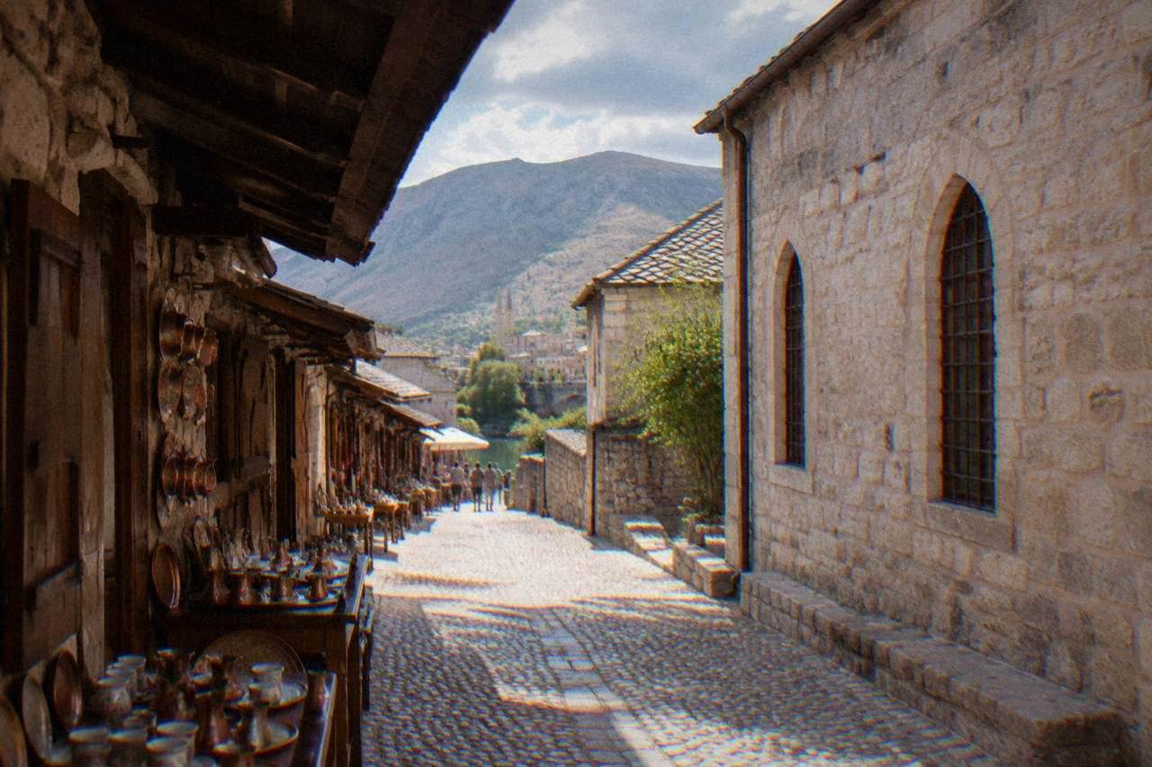 Stone museum building facade on a quiet street in central Mostar