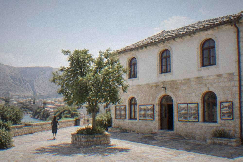 Old photographs and documents displayed on a museum wall