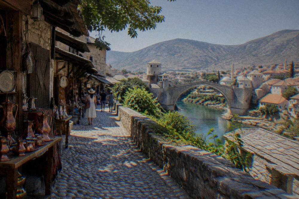 Summer view over the Neretva river and red roofs of central Mostar