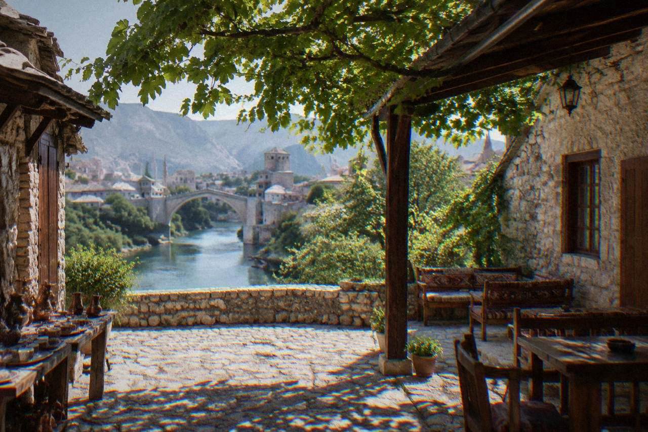 Stone courtyard of an Ottoman era house in Mostar with a shaded porch and vine covered trellis
