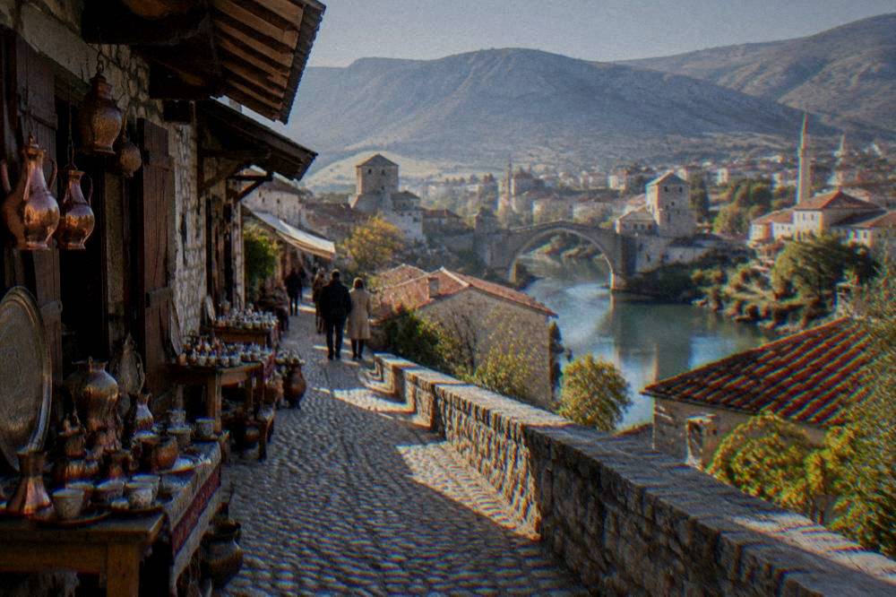 View over the red roofs of Mostar Old Town and the Neretva river from a hillside
