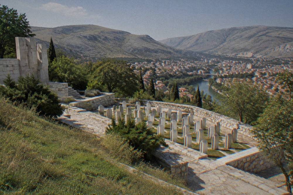 Rows of carved stone markers arranged on a memorial terrace