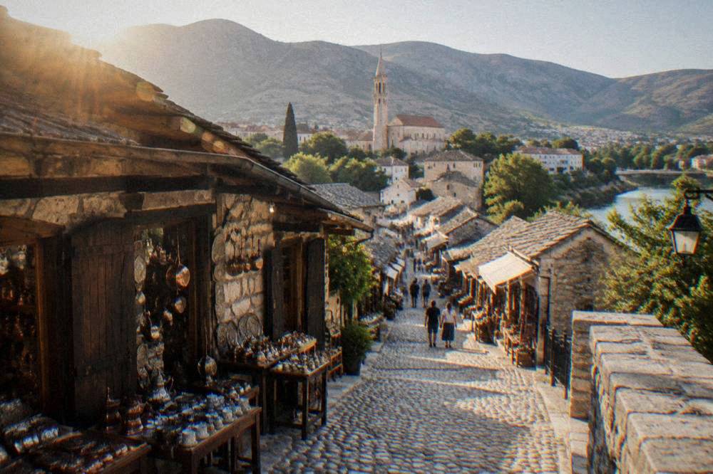 A broad street in western Mostar leading toward the Franciscan church district