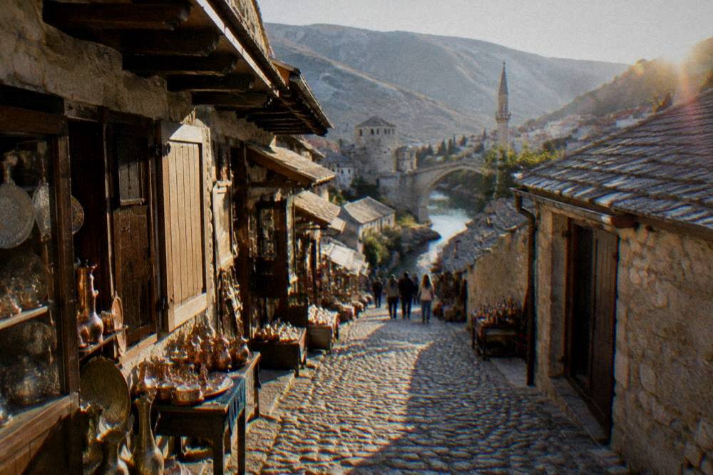 A narrow cobbled bazaar street lined with small stone shops