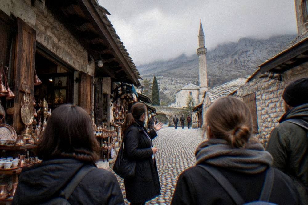 A guide speaking to a small group on a stone street in Mostar Old Town