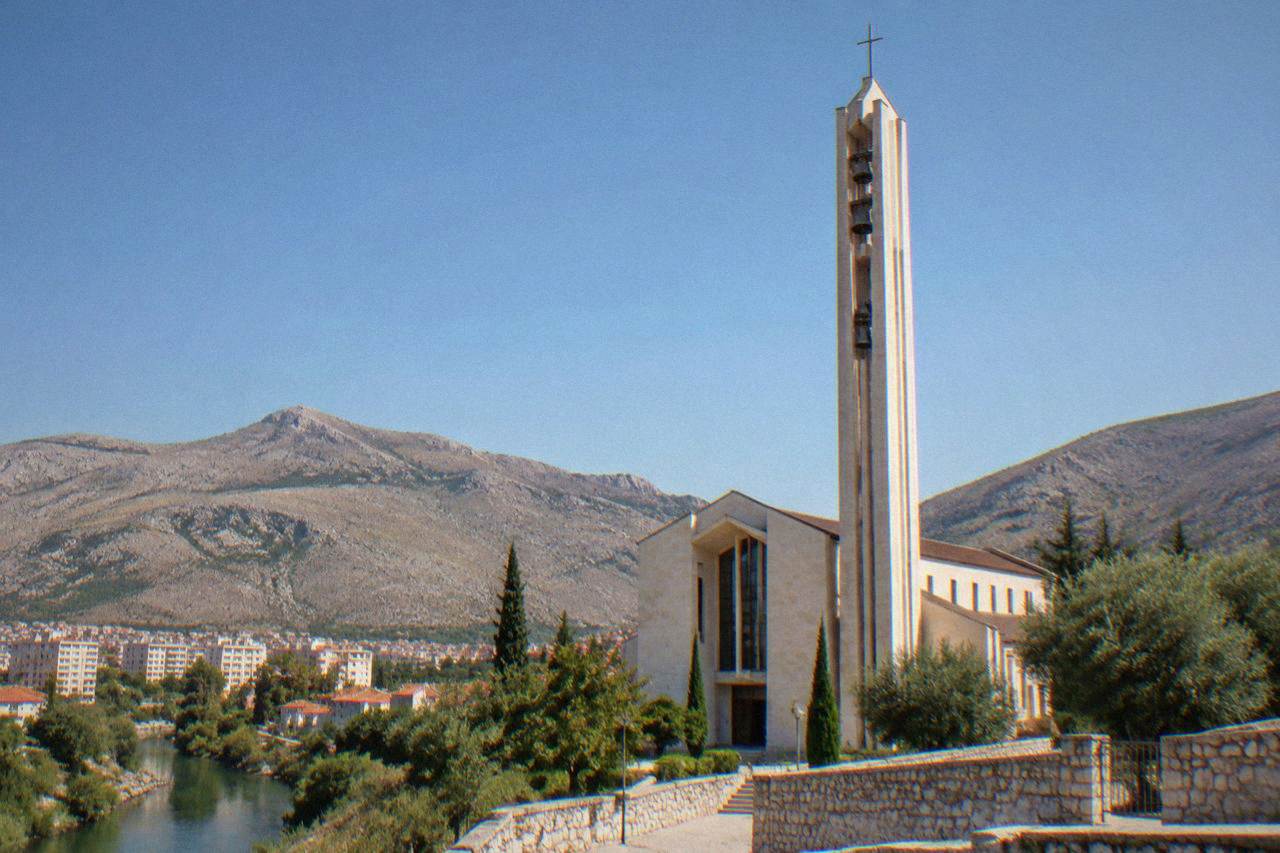 St James church in Međugorje with its tall bell tower under a clear sky