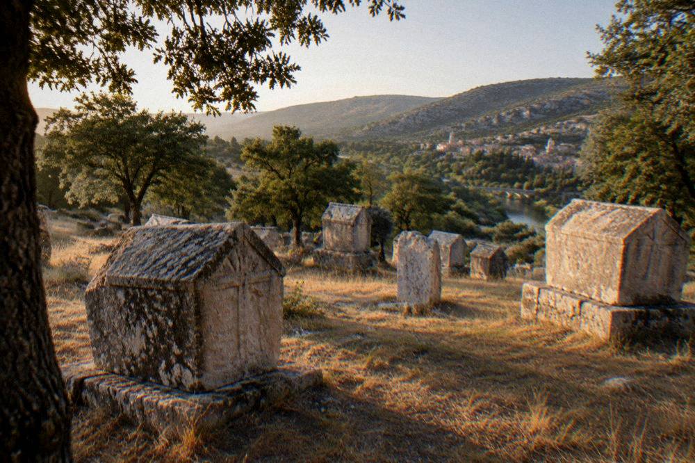 Wide view of the necropolis with the Bregava valley and hills behind Stolac