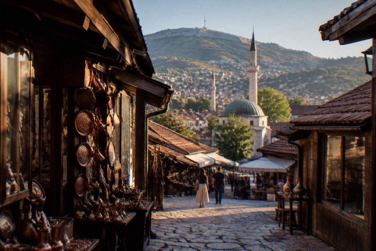 View over Sarajevo's rooftops with minarets and the surrounding hills at midday