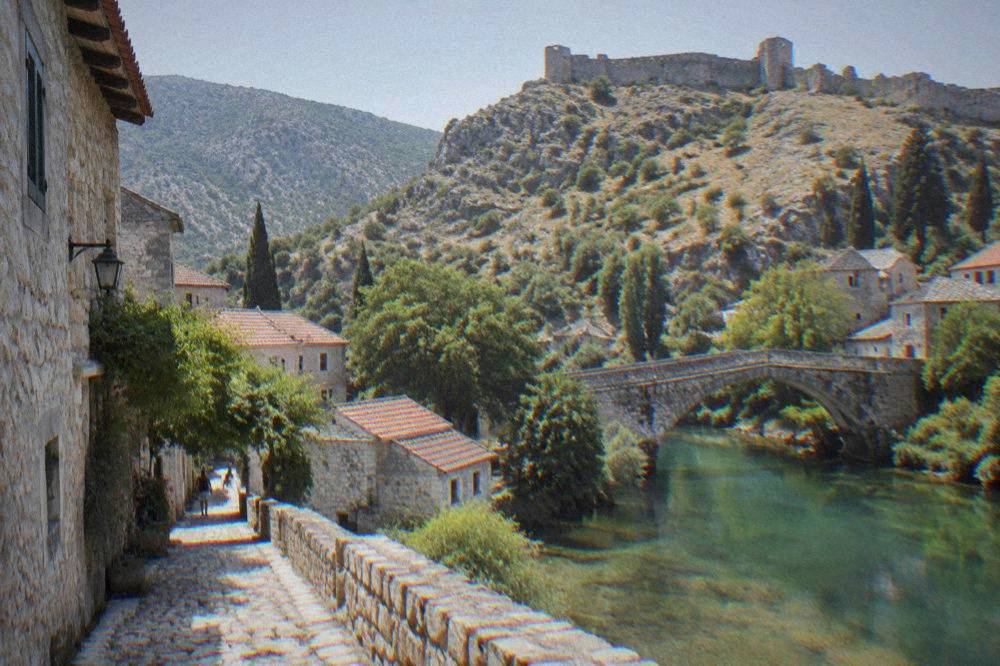 Narrow stone street with old houses in the Stolac Old Town