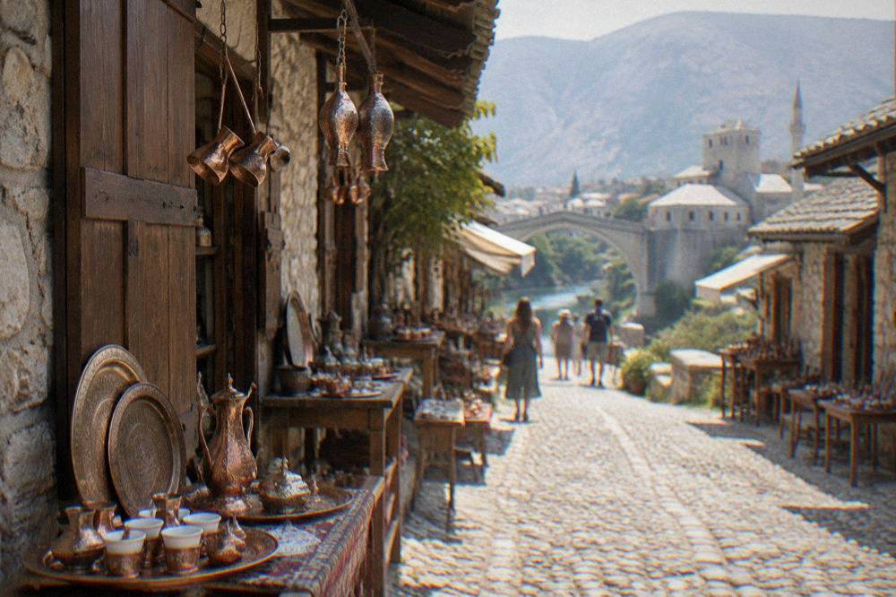 Cobbled street with tables outside stone buildings in the old bazaar quarter of Mostar