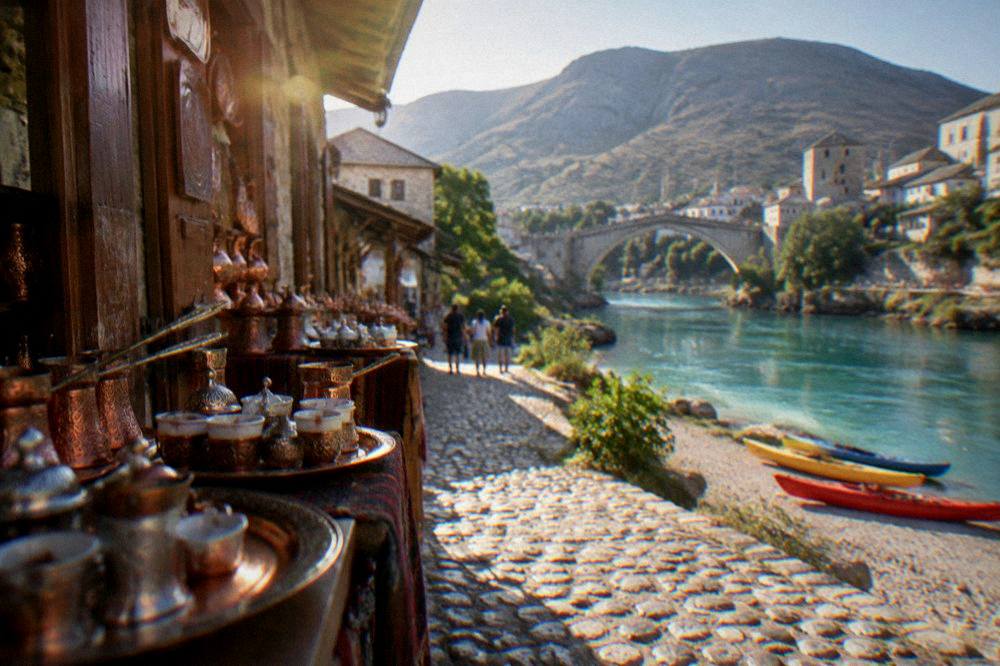 Kayaks pulled up on a gravel bank of the turquoise Neretva river near Mostar