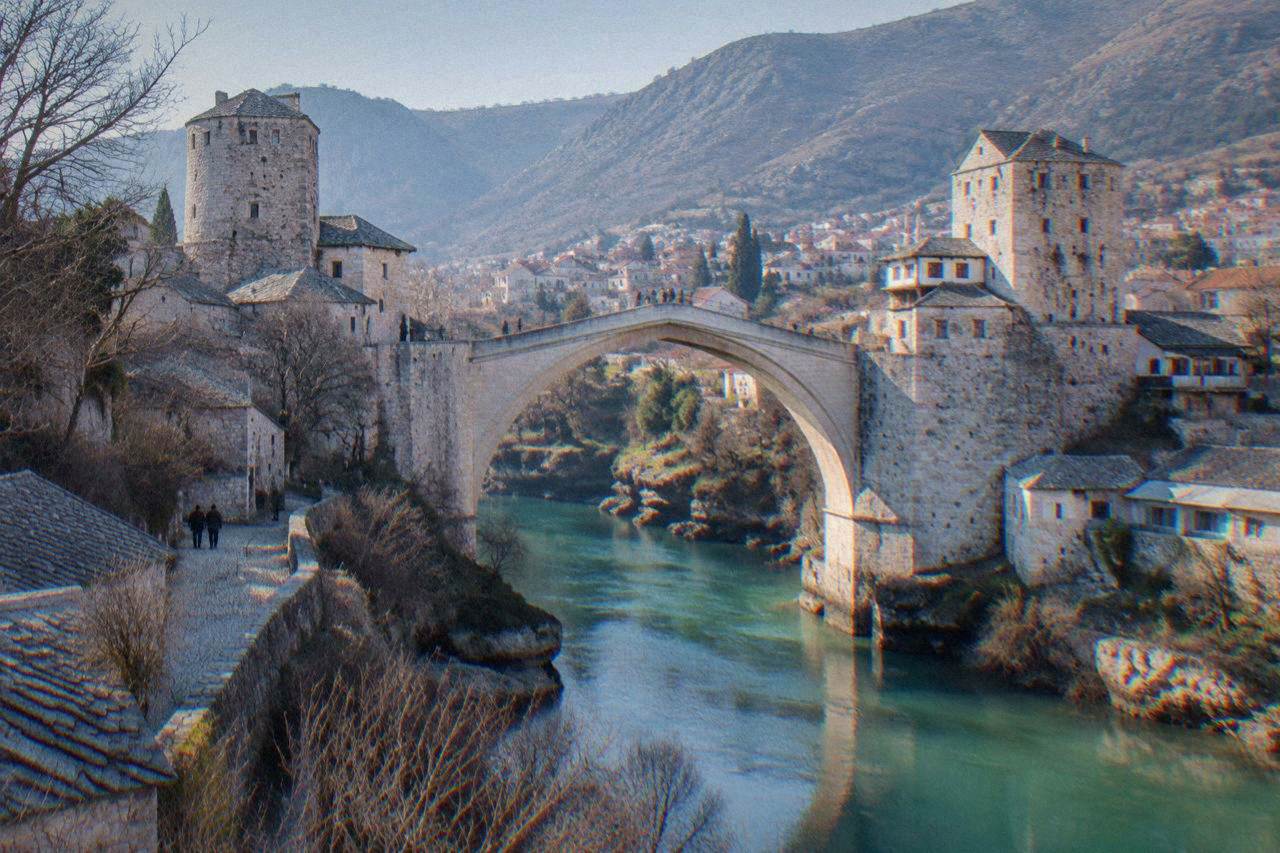 The pale Old Bridge arching over the turquoise Neretva river in Mostar