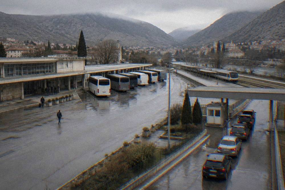 A queue of cars waiting at a small border control booth between Croatia and Bosnia