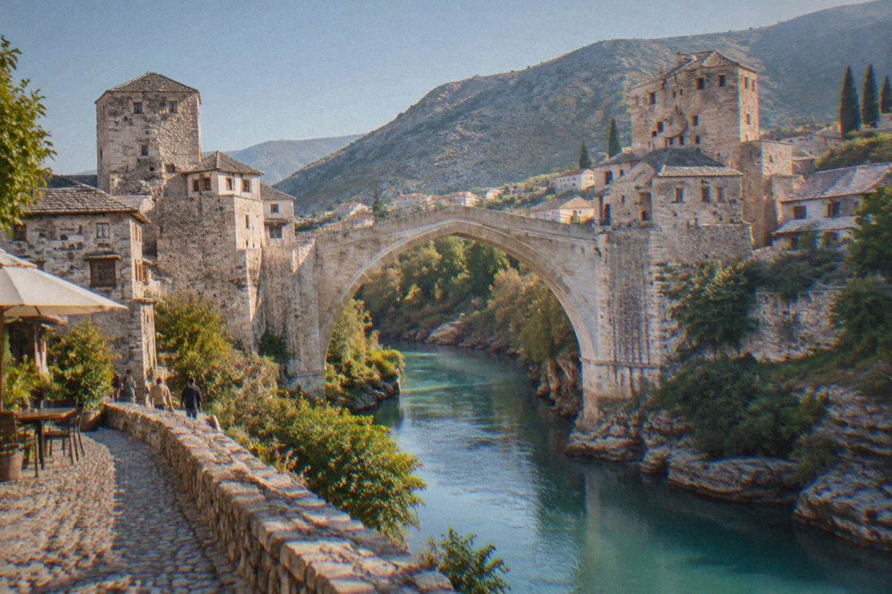 The stone arch of the Old Bridge in Mostar above the turquoise Neretva river