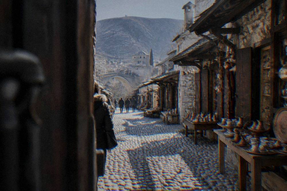 Cobblestone street of the Kujundžiluk bazaar lined with small shops in Mostar