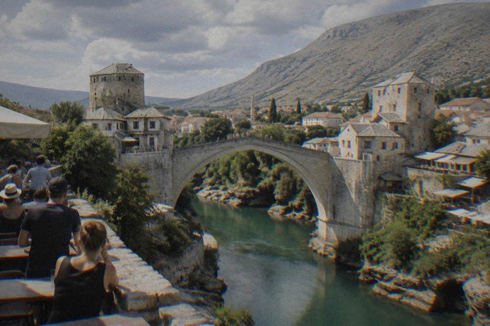 A diver leaping from the parapet of the Old Bridge into the Neretva river